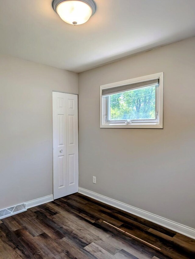 1514 173rd St, East Hazel Crest, IL 60429 - empty room featuring dark wood-style flooring and baseboards