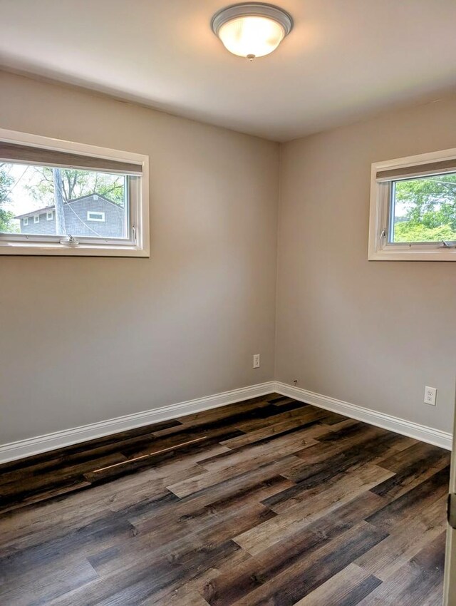 1514 173rd St, East Hazel Crest, IL 60429 - unfurnished room with baseboards and dark wood finished floors