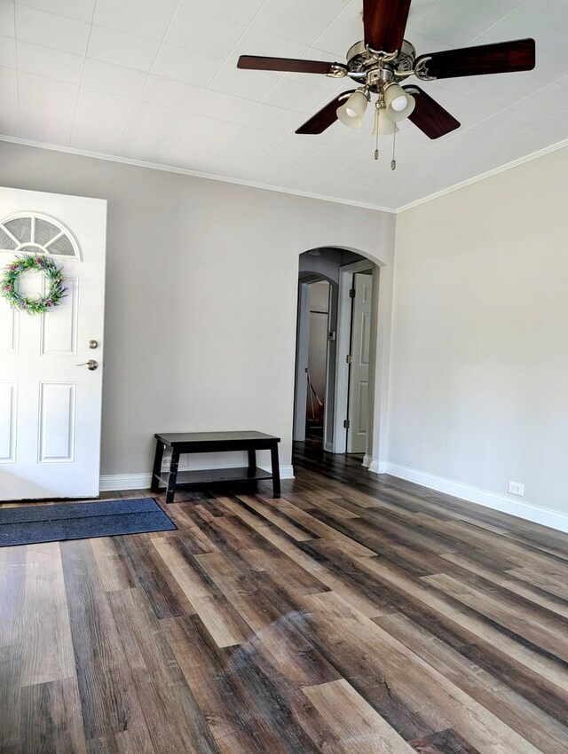 1514 173rd St, East Hazel Crest, IL 60429 - entrance foyer featuring arched walkways, dark wood finished floors, ceiling fan, baseboards, and ornamental molding