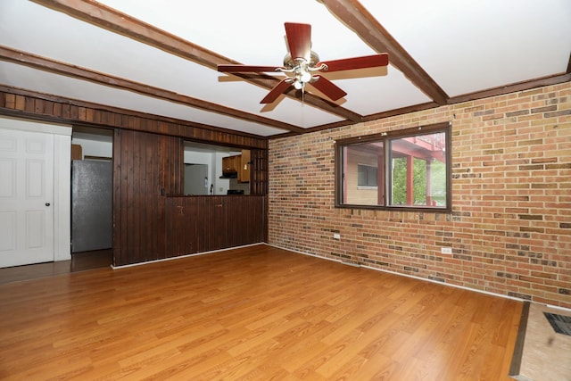 18557 W Country Ln, Grayslake, IL 60030 - unfurnished living room featuring brick wall, beam ceiling, light wood-style floors, and a ceiling fan