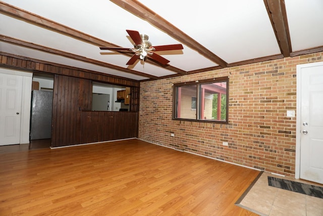 18557 W Country Ln, Grayslake, IL 60030 - unfurnished living room featuring brick wall, beamed ceiling, light wood-style flooring, and a ceiling fan