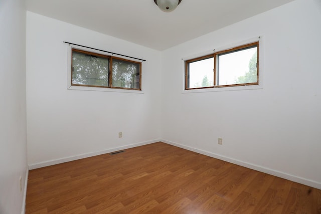 18557 W Country Ln, Grayslake, IL 60030 - unfurnished room with light wood-style flooring and baseboards