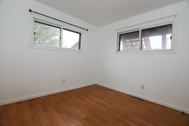 18557 W Country Ln, Grayslake, IL 60030 - unfurnished room with wood finished floors and baseboards
