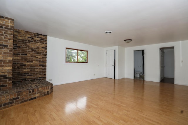 18557 W Country Ln, Grayslake, IL 60030 - unfurnished living room with light wood-style flooring and baseboards