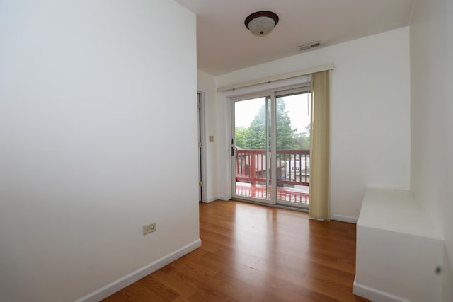 18557 W Country Ln, Grayslake, IL 60030 - unfurnished room with wood finished floors and baseboards