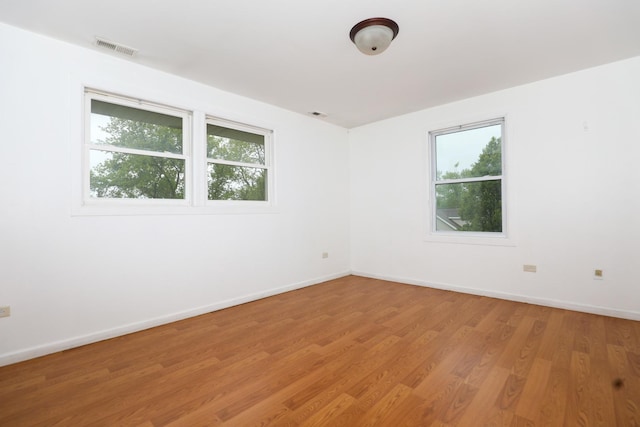 18557 W Country Ln, Grayslake, IL 60030 - unfurnished room with light wood finished floors and baseboards