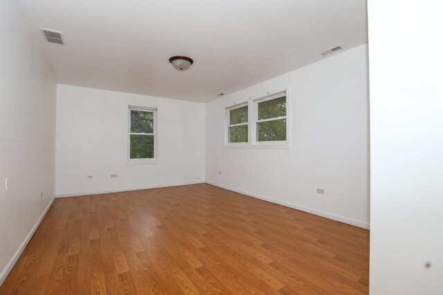 18557 W Country Ln, Grayslake, IL 60030 - empty room with light wood-style floors and baseboards