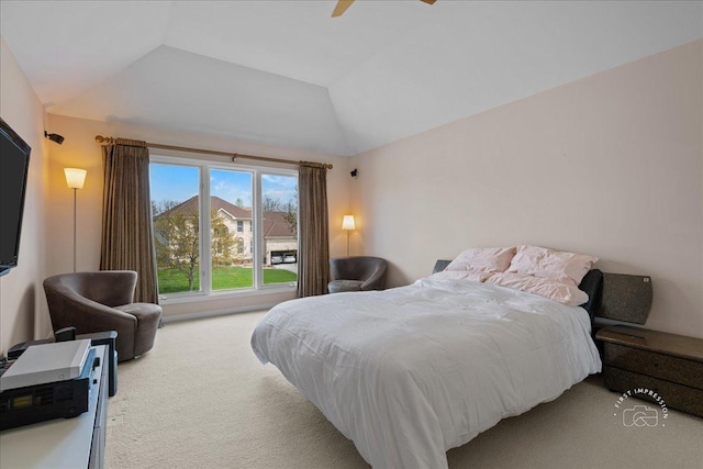 bedroom with carpet, ceiling fan, and vaulted ceiling