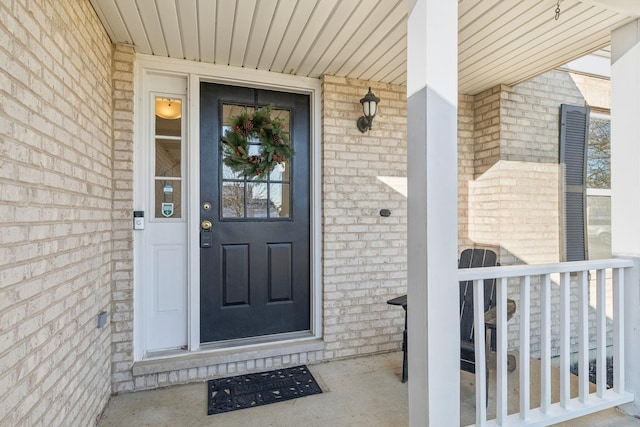 2851 Briarcliff Ln, Lake In The Hills, IL 60156 - doorway to property featuring covered porch and brick siding