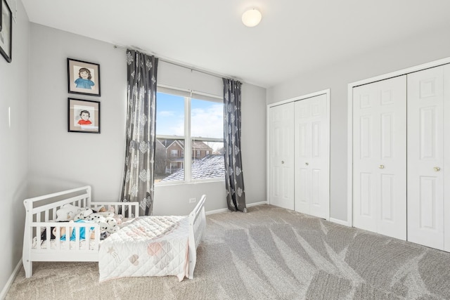 2851 Briarcliff Ln, Lake In The Hills, IL 60156 - carpeted bedroom featuring multiple closets and baseboards