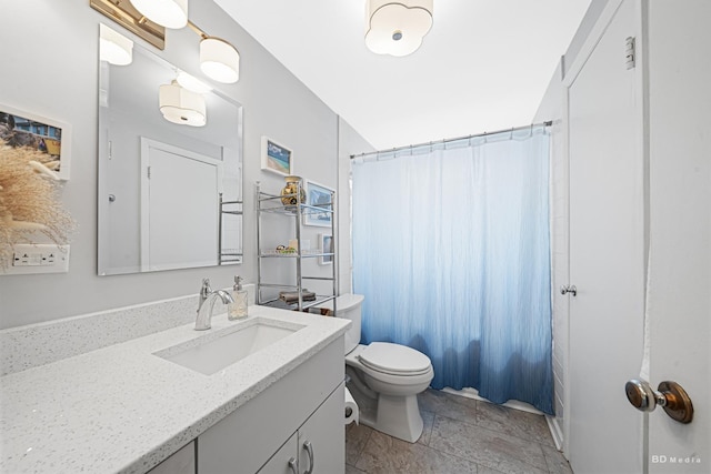 bathroom featuring vanity, toilet, and a shower with shower curtain
