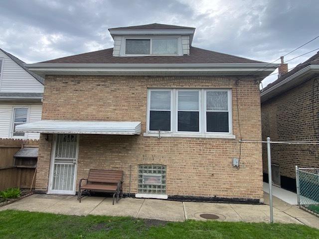 4816 S Harding Ave, Chicago, IL 60632 - back of house featuring brick siding, fence, and a patio area