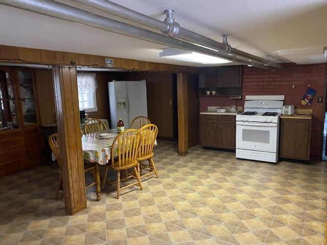 4816 S Harding Ave, Chicago, IL 60632 - kitchen featuring light floors, white appliances, and light countertops
