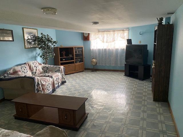 4816 S Harding Ave, Chicago, IL 60632 - living room with tile patterned floors and baseboards