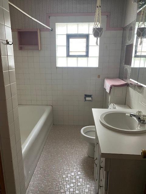 4816 S Harding Ave, Chicago, IL 60632 - full bath with toilet, vanity, wallpapered walls, and tile walls