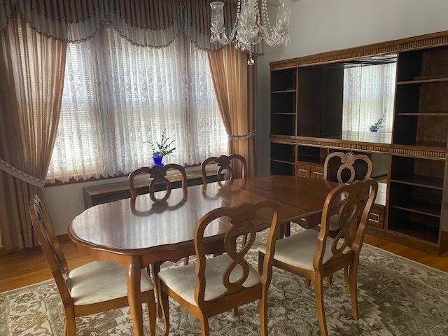 4816 S Harding Ave, Chicago, IL 60632 - dining space with a chandelier, wood finished floors, and a wealth of natural light