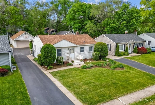 502 Everett Ave, Crystal Lake, IL 60014 - view of front of property with a detached garage, an outdoor structure, and a front lawn