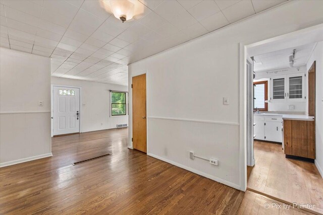 502 Everett Ave, Crystal Lake, IL 60014 - unfurnished room featuring wood finished floors and a sink