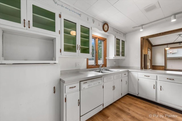 502 Everett Ave, Crystal Lake, IL 60014 - kitchen with dishwasher, track lighting, light countertops, white cabinetry, and a sink
