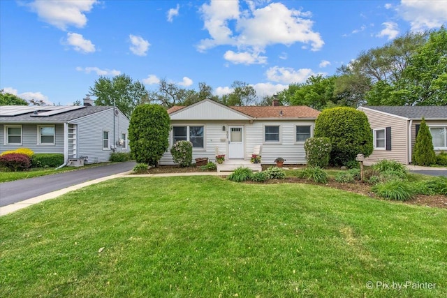 502 Everett Ave, Crystal Lake, IL 60014 - ranch-style house featuring a front yard and a chimney