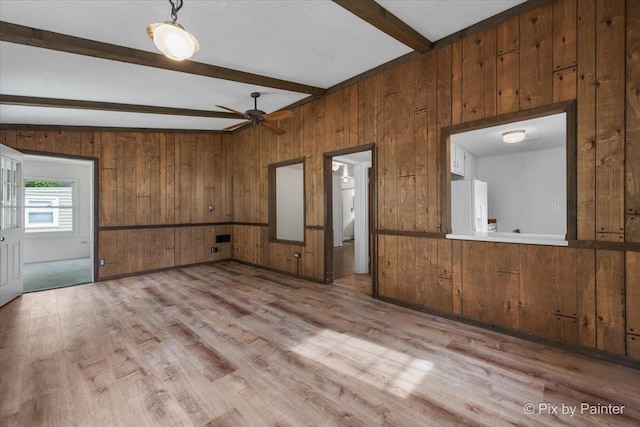 502 Everett Ave, Crystal Lake, IL 60014 - spare room with wood walls, beamed ceiling, light wood-style floors, and ceiling fan