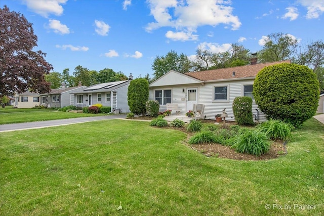502 Everett Ave, Crystal Lake, IL 60014 - ranch-style home featuring a front lawn and a chimney