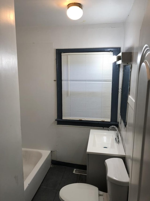 full bath with vanity, toilet, tile patterned floors, a tub, and visible vents
