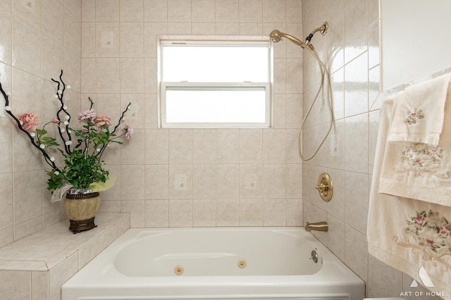 bathroom with a combined bath / shower with jetted tub