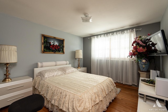 bedroom featuring wood finished floors