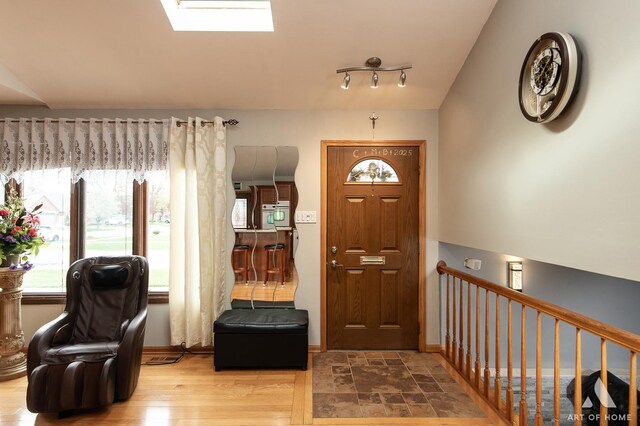 foyer entrance with a skylight