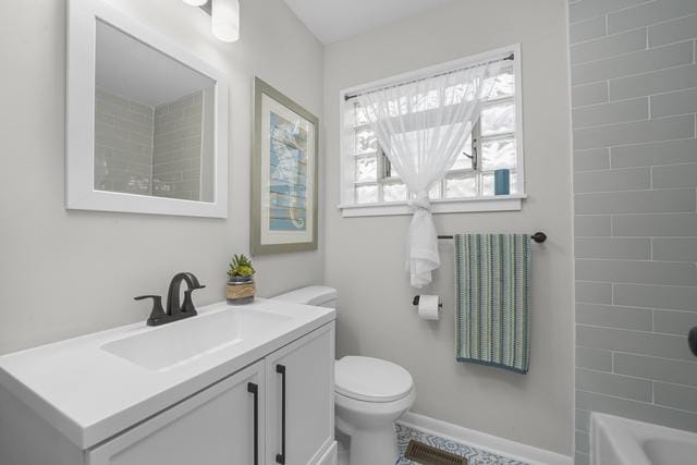 2716 N 73rd Ave, Elmwood Park, IL 60707 - bathroom with shower / bathing tub combination, vanity, toilet, and baseboards