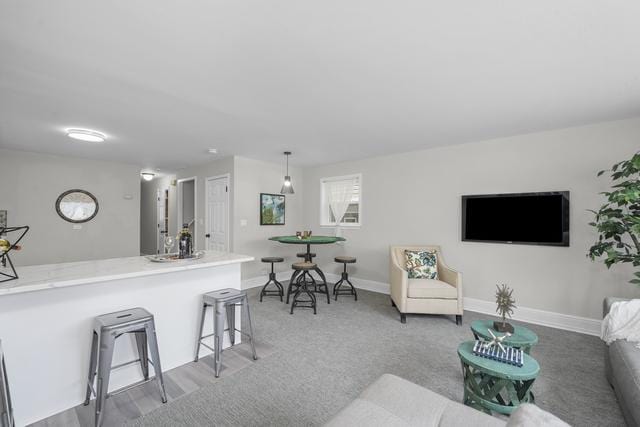 2716 N 73rd Ave, Elmwood Park, IL 60707 - living room featuring baseboards and light carpet