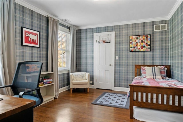 bedroom with visible vents, ornamental molding, and wood finished floors