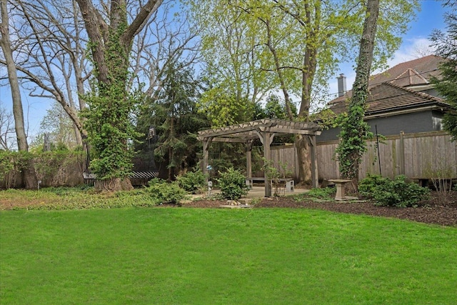 view of yard featuring a pergola and fence