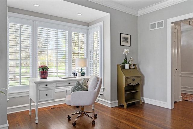 office area with crown molding, baseboards, visible vents, and wood finished floors