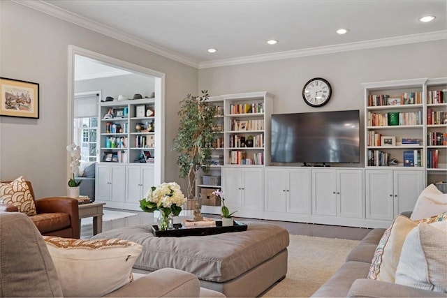 living room featuring crown molding and recessed lighting