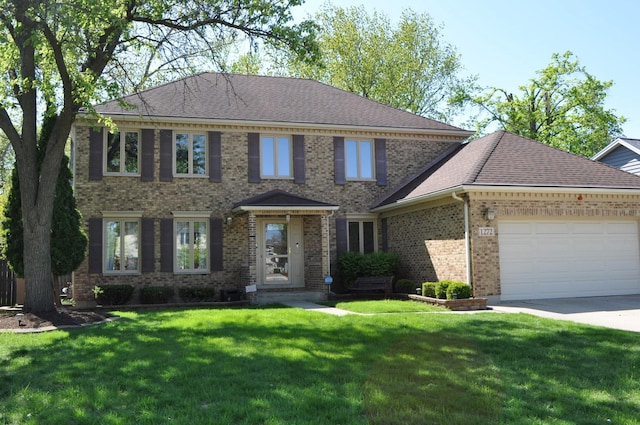 1272 N Scarlet Dr, Addison, IL 60101 - colonial inspired home with brick siding, a front yard, a garage, driveway, and roof with shingles