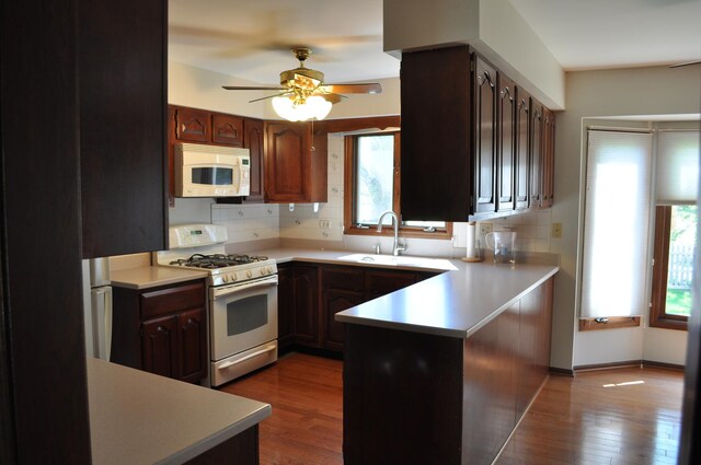 1272 N Scarlet Dr, Addison, IL 60101 - unfurnished living room featuring track lighting, washer / dryer, a fireplace, wood finished floors, and ornamental molding