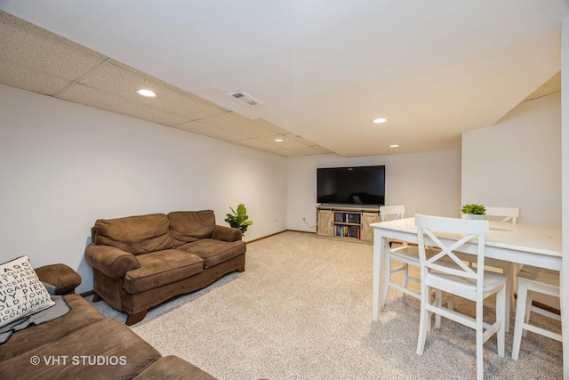 living area featuring baseboards, light colored carpet, recessed lighting, and visible vents