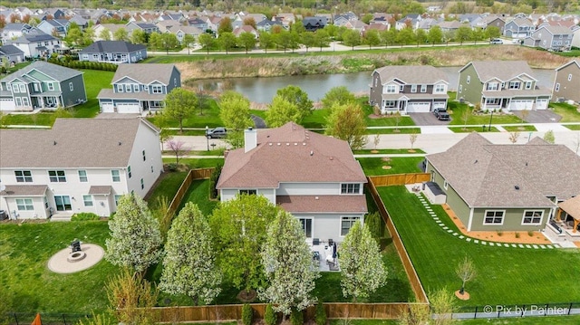 bird's eye view with a water view and a residential view