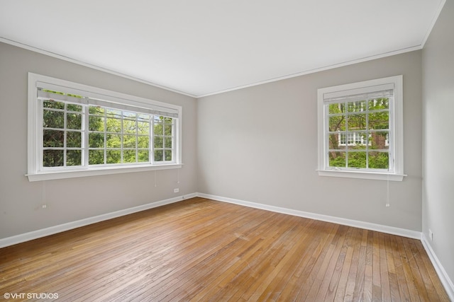 444 Winnetka Ave, Winnetka, IL 60093 - empty room with ornamental molding, light wood-style flooring, and baseboards