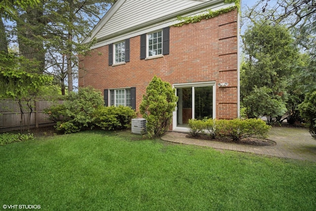 444 Winnetka Ave, Winnetka, IL 60093 - back of house with central air condition unit and brick siding