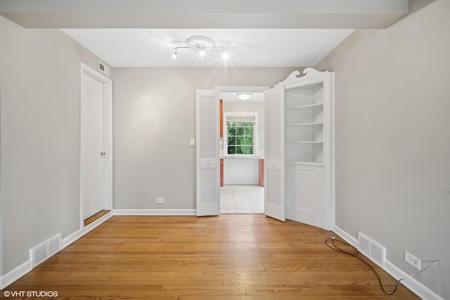 444 Winnetka Ave, Winnetka, IL 60093 - unfurnished room with light wood-style floors and baseboards