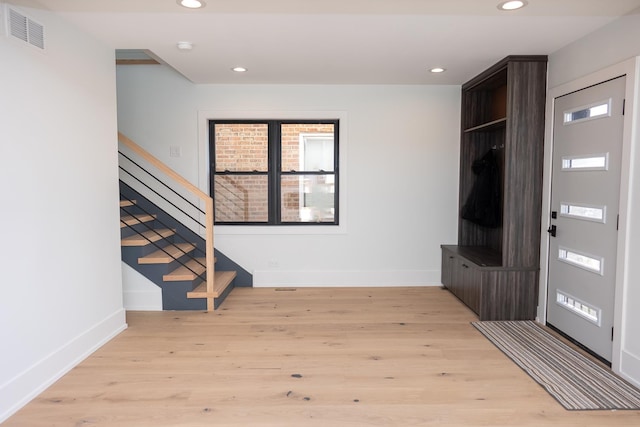 interior space with visible vents, recessed lighting, stairway, and light wood-type flooring