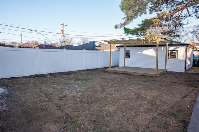 view of yard featuring a fenced backyard, a wooden deck, and a pergola