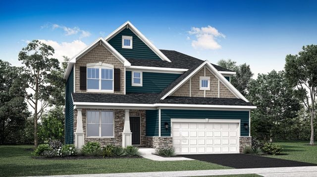 view of front of house featuring driveway, roof with shingles, a front yard, and a garage