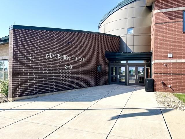view of building exterior with cooling unit