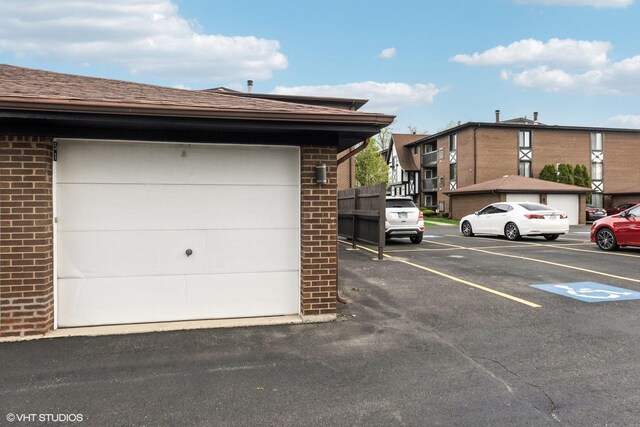 garage featuring uncovered parking