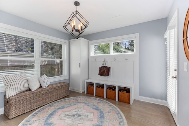 1137 Griffith Rd, Lake Forest, IL 60045 - mudroom with a chandelier, baseboards, and light wood-style flooring