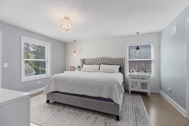 1137 Griffith Rd, Lake Forest, IL 60045 - bedroom with wood finished floors, a chandelier, and baseboards
